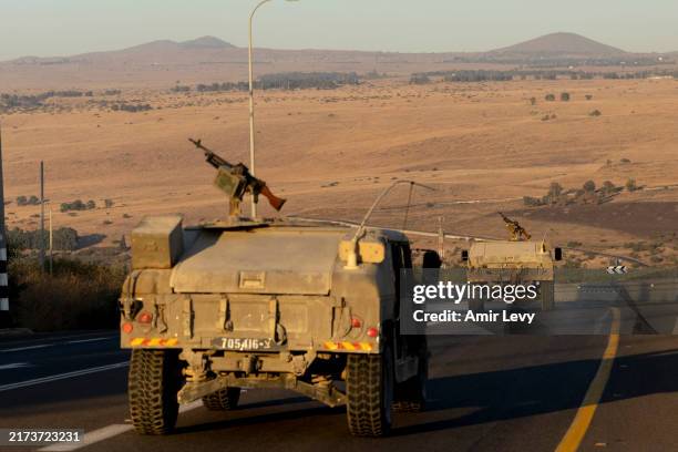 Israeli army vehicles move through the north on September 26, 2024 in Northern Israel, Israel. Hezbollah's missiles continued to land in the area...