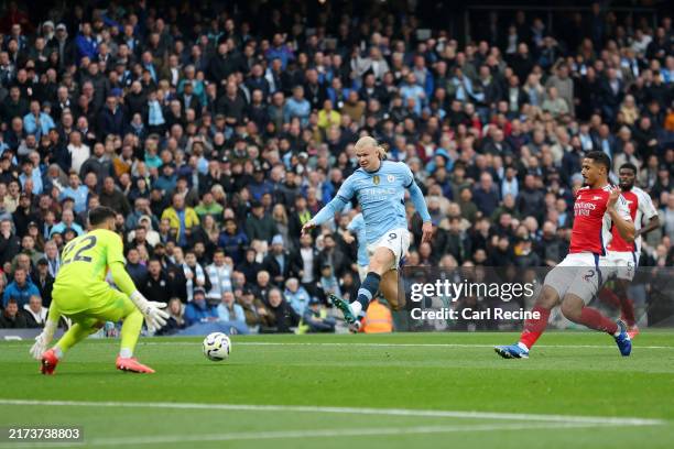 Erling Haaland of Manchester City scores his team's first goal during the Premier League match between Manchester City FC and Arsenal FC at Etihad...