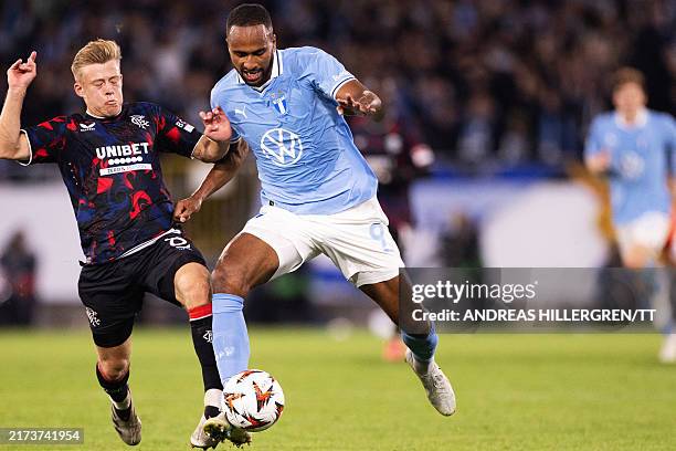 Glasgow Rangers' Scottish midfielder Connor Barron and Malmoe's Swedish forward Isaac Kiese Thelin vie for the ball during the UEFA Europa League...