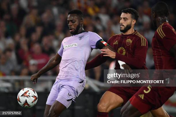 Athletic Bilbao's Ghanaian forward Inaki Williams fights for the ball with Roma's Spanish defender Mario Hermoso during the Europa League football...