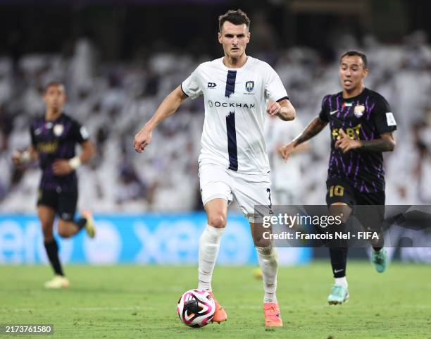 Adam Mitchell of Auckland City FC runs with the ball during the FIFA Intercontinental Cup match between Al Ain FC and Auckland City at Hazza bin...