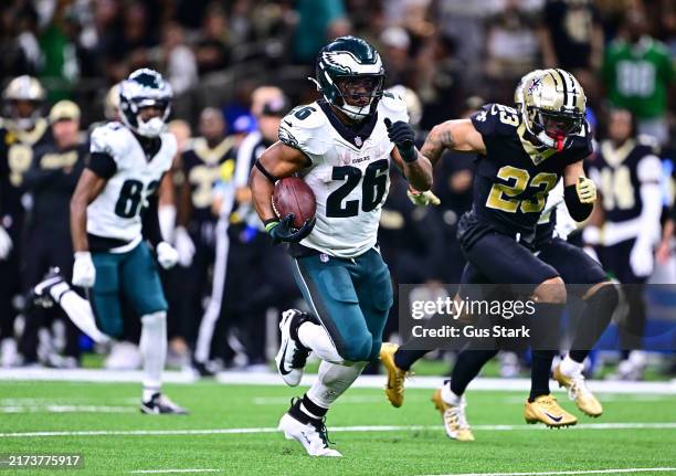 Saquon Barkley of the Philadelphia Eagles runs for a touchdown against the New Orleans Saints during the fourth quarter at Caesars Superdome on...