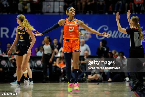 DiJonai Carrington of the Connecticut Sun celebrates after making a three-pointer against the Indiana Fever during the second half of a first round...