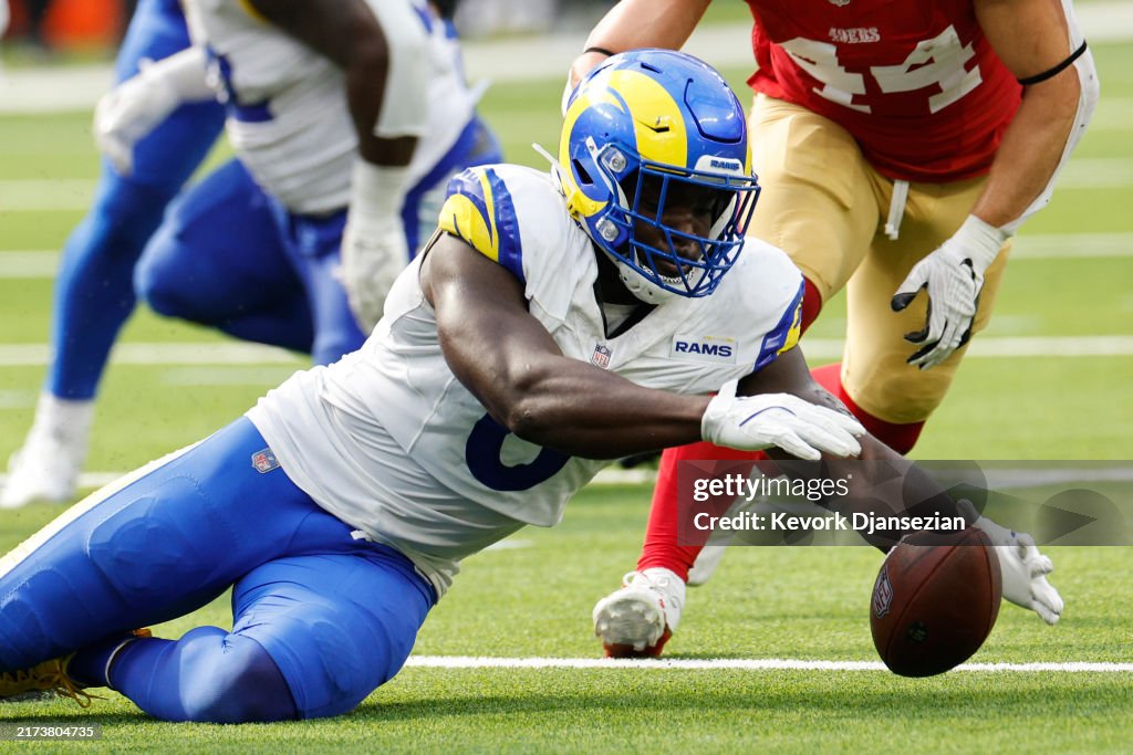 Id Center Rasm Byron Young of the Los Angeles Rams recovers a fumble against the San ...