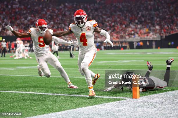 Rashee Rice of the Kansas City Chiefs scores a touchdown while defended by Dee Alford of the Atlanta Falcons during the second quarter at...