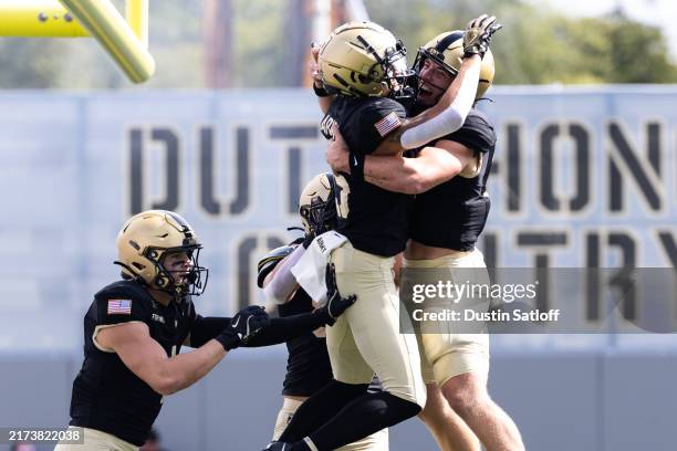 Bryson Rice Noah Short and Bryson Daily of the Army Black Knights celebrate after ...