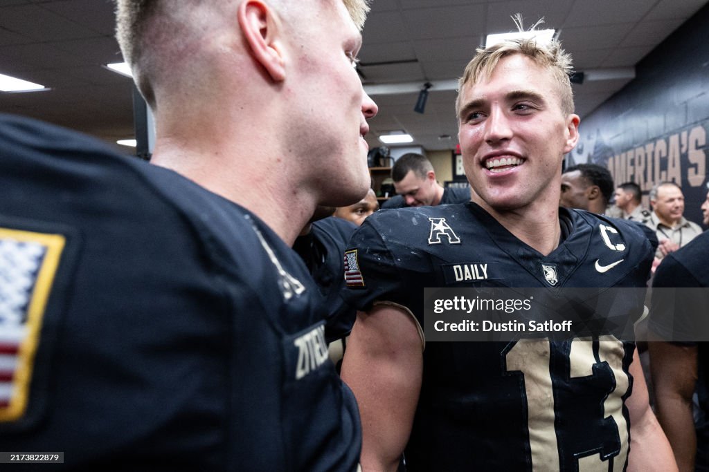 Lucas Rice Army Bryson Daily of the Army Black Knights looks on in the locker room ...
