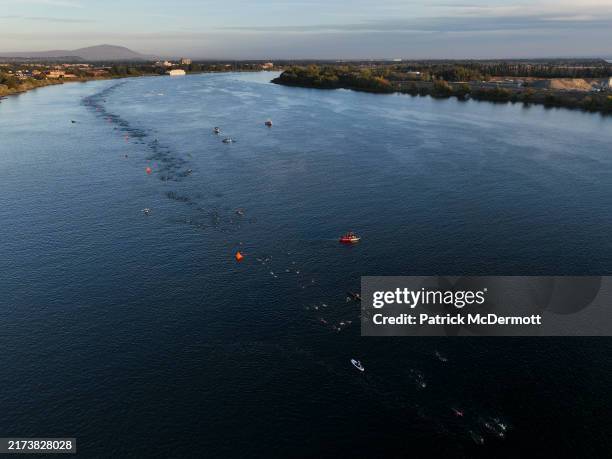 An aerial view as age group athletes swim in the Columbia River during the swim course at 2024 IRONMAN 70.3 Washington Tri-Cities on September 22,...