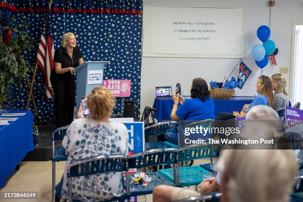 Democratic candidate for NC Senate District 37 Kate Compton Barr laughs as she speaks with campaign volunteers and potential voters during a...