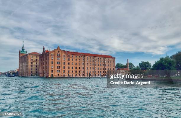 venice, italy, photo of the famous molino stucky, neo-gothic architecture applied to an industrial building. - stucky stock pictures, royalty-free photos & images