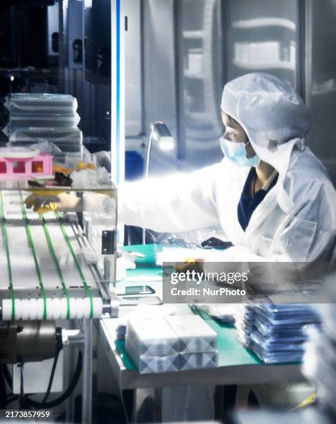 Workers at a liquid crystal display manufacturer work at Shanting Economic Development Zone in Zaozhuang, China, on September 25, 2024.