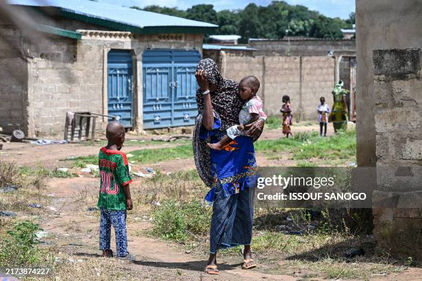 Woman , who saw her two sons killed by gun men during an attack in Burkina Faso and who took refuge with her grandchildren at a family, reacts in...