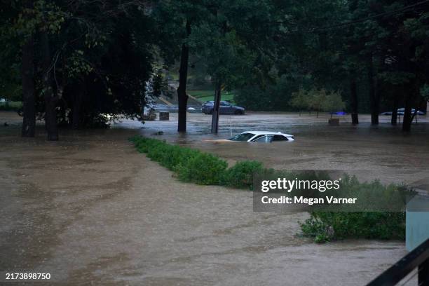 Car is submerged in the floodwaters in the Buckhead neighborhood in the aftermath of Hurricane Helene on September 27, 2024 in Atlanta, Georgia....