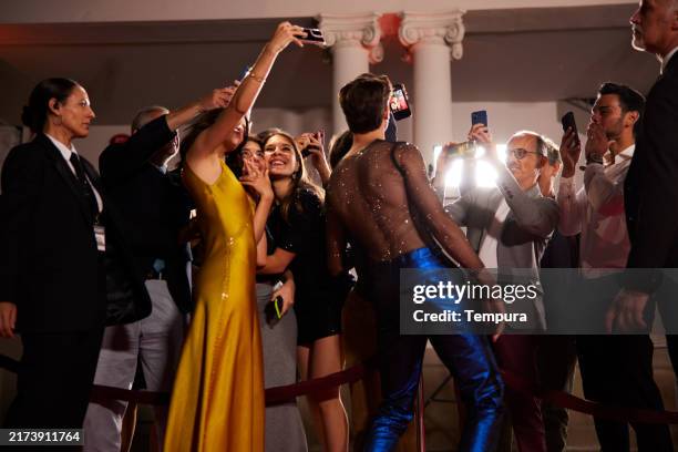 young influencers gather for a fun selfie with the autograph hunters. - photo messaging stock pictures, royalty-free photos & images