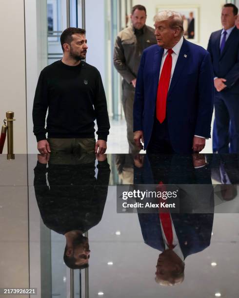 Ukrainian President Volodymyr Zelensky and Republican presidential nominee, former U.S. President Donald Trump, gather for a meeting on September 27,...