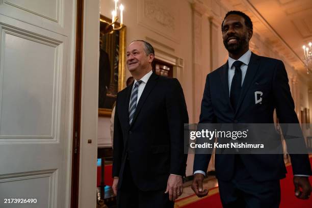 Second Gentleman Doug Emhoff and Columbus Crew head coach Wilfried Nancy arrive for an event in the East Room of the White House on September 27,...