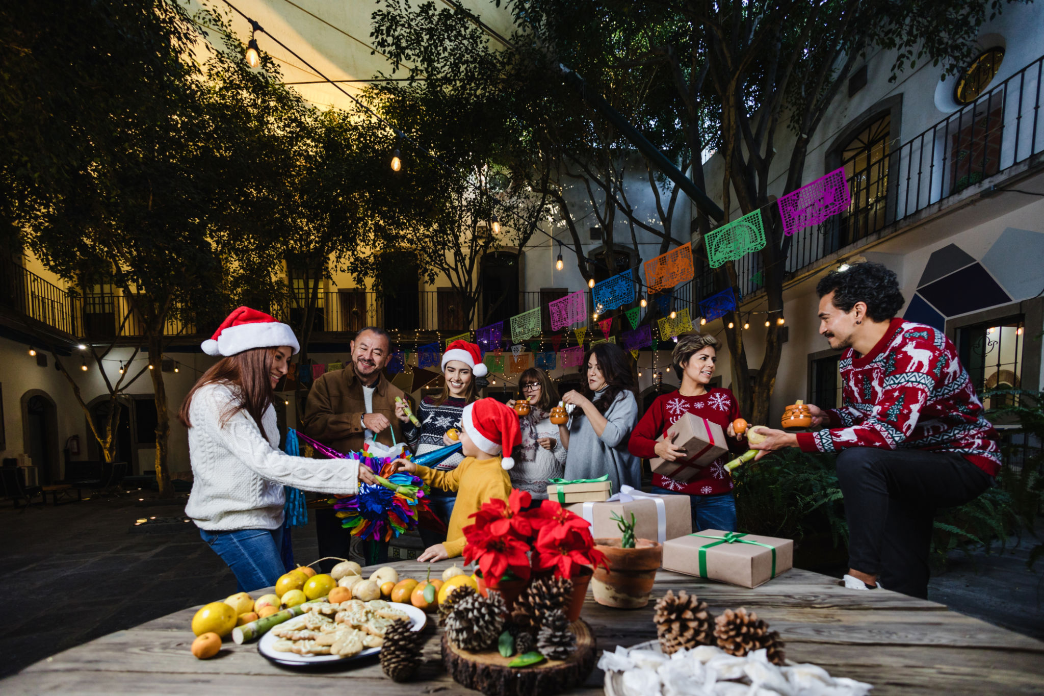 Mexican Family celebrating traditional party or posadas for Christmas eve and holidays in Mexico Latin America Mexican Family celebrating traditional party or posadas for Christmas eve and holidays in Mexico Latin America