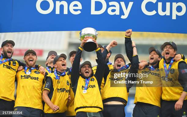 Kiran Carlson of Glamorgan lifts the Metro Bank One Day Cup following the Metro Bank One Day Cup Final match between Somerset and Glamorgan at Trent...