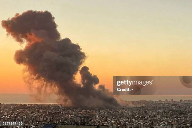 Smoke rises above Beirut's southern suburbs during an Israeli strike on September 27, 2024. A source close to Hezbollah said the massive Israeli...