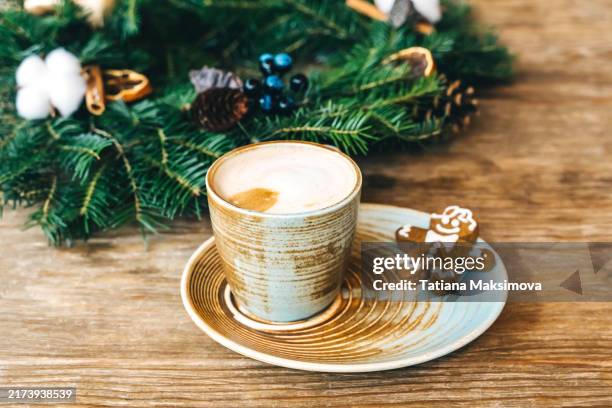 cappuccino in a beautiful ceramic cup on a wooden table. - turquoise christmas ornaments stock pictures, royalty-free photos & images