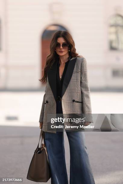 Füsun Lindner is seen wearing rimless square-shaped sunglasses with grey gradient lenses and slim silver metal temples and nose bridge from Yves...