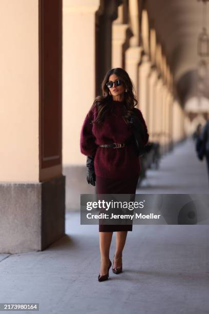 Füsun Lindner is seen wearing black squared sunglasses; large gold drop-shaped earrings from Bottega Veneta; an outfit from Dorothee Schumacher,...