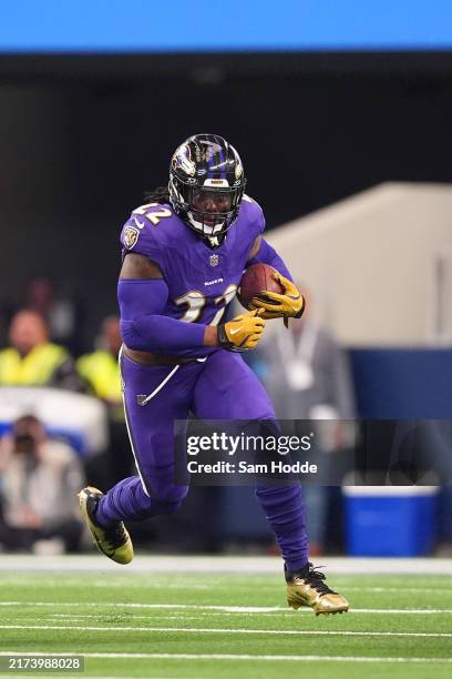 Baltimore Ravens running back Derrick Henry runs with the ball during the first half against the Dallas Cowboys at AT&T Stadium on September 22, 2024...