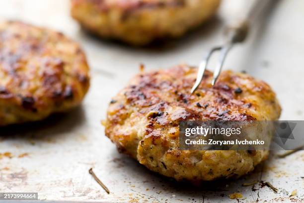 chicken burger on a baking sheet. selective focus - chicken burger stock pictures, royalty-free photos & images