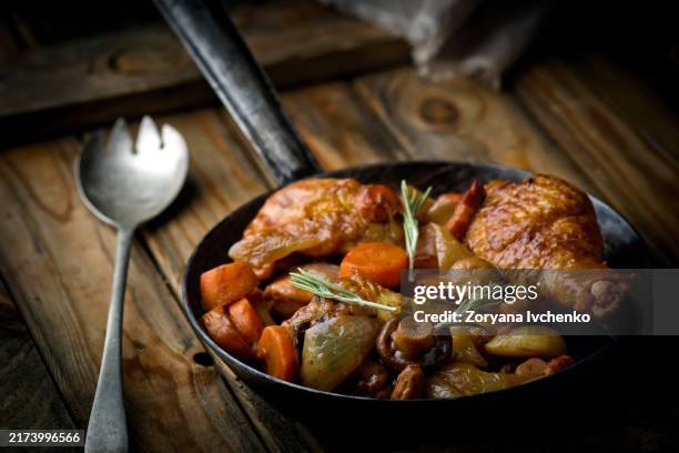 chicken with mushrooms and vegetables, stewed in wine. style rustic . french cuisine - stew stock pictures, royalty-free photos & images