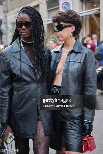 Guest wears MM6 shades and long leather jacket,a guest wears biker jacket during the Milan Fashion Week Menswear Spring/Summer 2025 on September 21,...