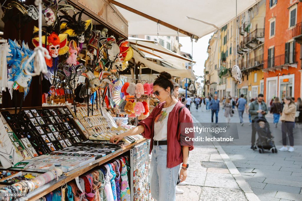 Woman shopping on a street market in Verona, Italy