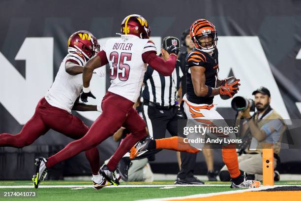 Ja'Marr Chase of the Cincinnati Bengals scores a 41 yard touchdown against the Washington Commanders during the first quarter at Paycor Stadium on...