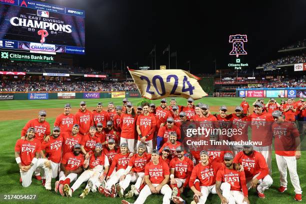The Philadelphia Phillies pose for a team photo after clinching the 2024 NL East Division at Citizens Bank Park on September 23, 2024 in...