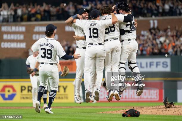 Zach McKinstry, Matt Vierling, Will Vest, Jason Foley and Jake Rogers of the Detroit Tigers celebrate after winning the game against the Chicago...