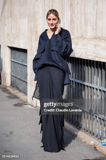 Olivia Palermo wears dark blue polo neck top, black maxi skirt, outside Max Mara, during the Milan Fashion Week Spring/Summer 2025 on September 19,...