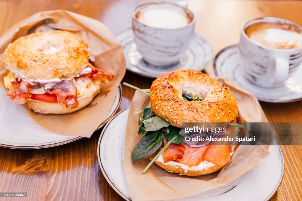 Bagel with cream cheese and salmon, bacon and egg served for breakfast at a restaurant