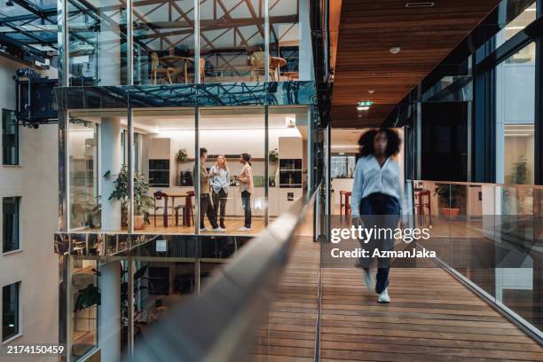 diverse executives in modern office cafe - coworking stock pictures, royalty-free photos & images