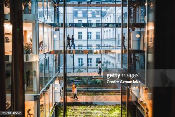 diverse professionals in contemporary office environment - business finance and industry stock pictures, royalty-free photos & images