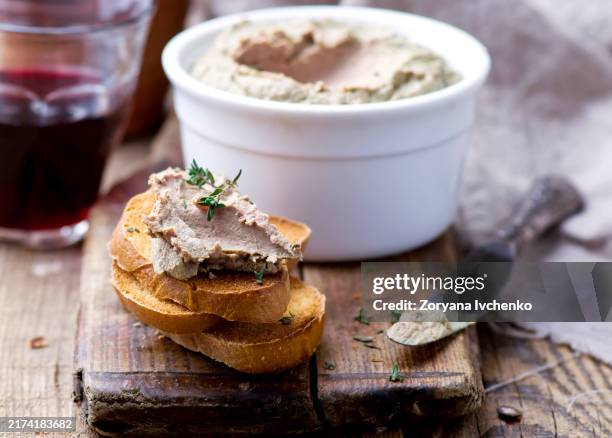 paste from a chicken liver, toasts, a glass with wine on a wooden table - pate stock pictures, royalty-free photos & images