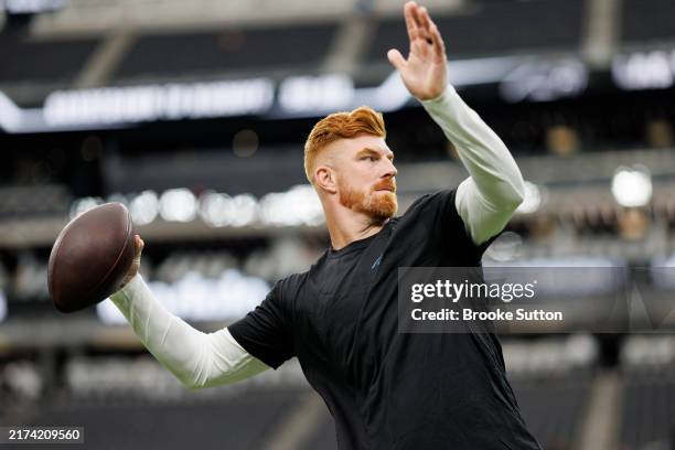 Quarterback Andy Dalton of the Carolina Panthers warms up prior to an NFL football game against the Las Vegas Raiders, at Allegiant Stadium on...