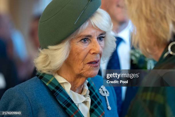 Britain's Queen Camilla speaks to the local heroes, who were nominated to attend by their MSPs, following an event at the Scottish Parliament at...