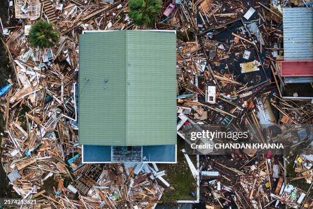 An aerial view of damaged houses are seen after Hurricane Helene made landfall in Horseshoe Beach, Florida, on September 28, 2024. At least 44 people...