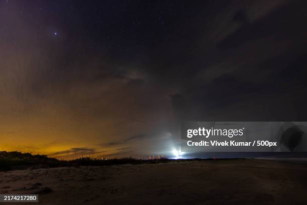 creative photography - night sky at beach - spaceport stock pictures, royalty-free photos & images