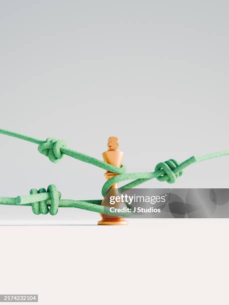 king pice being pulled in multiple direction by rope - pulled in different directions stock pictures, royalty-free photos & images