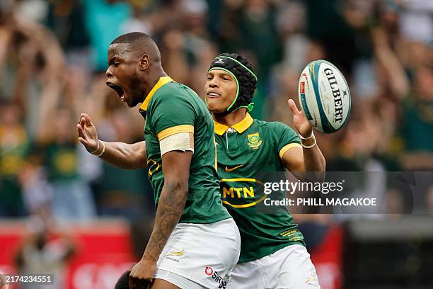 South Africa's full back Aphelele Fassi celebrates after scoring the team's first try during the Rugby Championship Test match between South Africa...