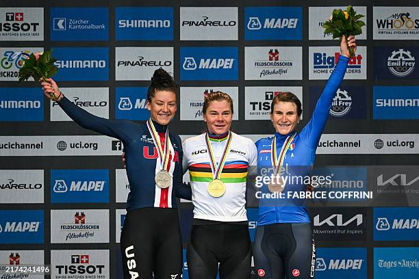 Second-placed US' Chloe Dygert, winner Belgium's Lotte Kopecky and third-placed Italy's Elisa Longo Borghini celebrate during the podium ceremony of...