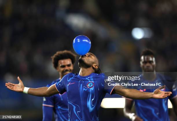Christopher Nkunku of Chelsea celebrates scoring his team's fifth goal, and completing his hattrick by blowing up a ballon during the Carabao Cup...