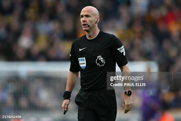Referee Anthony Taylor reacts during the English Premier League football match between Wolverhampton Wanderers and Liverpool at the Molineux stadium...