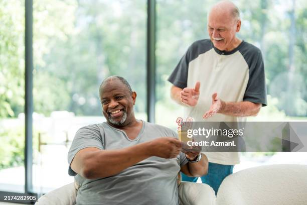 sobriety celebration with cupcake at rehab center - encouragement stock pictures, royalty-free photos & images