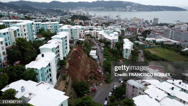 Buildings at risk of collapse after a retaining wall failed due to heavy rains following Hurricane John are pictured in Acapulco, Guerrero State,...